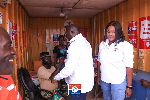 Vice President Dr. Mahamudu Bawumia exchanging pleasantries with a resident of Ada