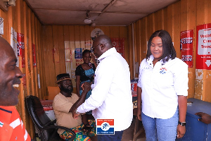 Vice President Dr. Mahamudu Bawumia exchanging pleasantries with a resident of Ada