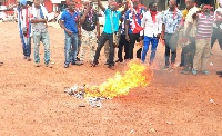 Angry NPP serial callers burning some party items
