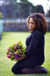 File photo of a widow at a cemetery (photo credit, Pinterest)