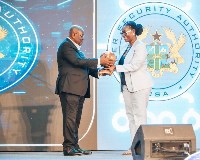 Mrs. Ursula Owusu-Ekuful receiving the award from President Akufo-Addo