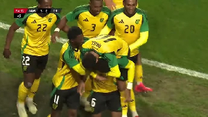 Jamaican players celebrating after scoring the third goal to win against Trinidad and Tobago