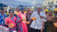 Some of the residents having a taste of the pito