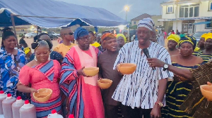Some of the residents having a taste of the pito