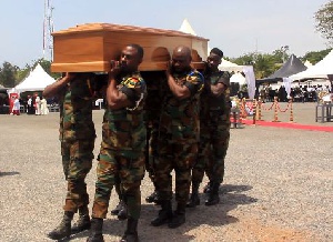 Military personnel carrying the mortal remains of K.B Asante
