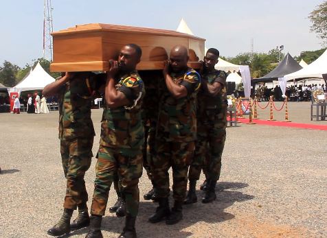 Military personnel carrying the mortal remains of K.B Asante