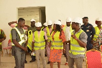 Catherine Abelema Afeku interacting with the project contractor