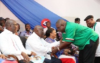 Koku Anyidoho, shaking hands with President Akufo-Addo