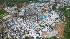 An aerial view of a factory whose roof was ripped off by the tornado