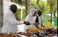 Dr Bawumia and his wife serving food at the Weija Leprosarium