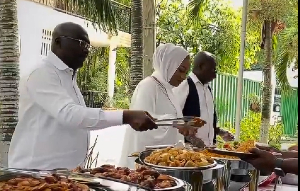 Dr Bawumia and his wife serving food at the Weija Leprosarium