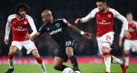 West Ham United midfielder Andre Ayew, attacking the ball from the middle