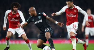 West Ham United midfielder Andre Ayew, attacking the ball from the middle