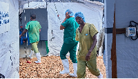 Health workers walk, at the Evangelical Medical Center, in Bunia, eastern Congo, 3 July 2026