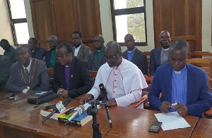 Rt. Rev. Christopher Nyarko Andam (in white robe) during a press conference