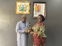 Ricky Adelayitar presents his Best Actor award won to Dzifa Gomashie