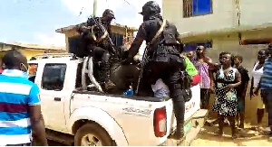 Policemen escorting the thugs to the police station