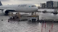 Photo of a flooded airport with a plane