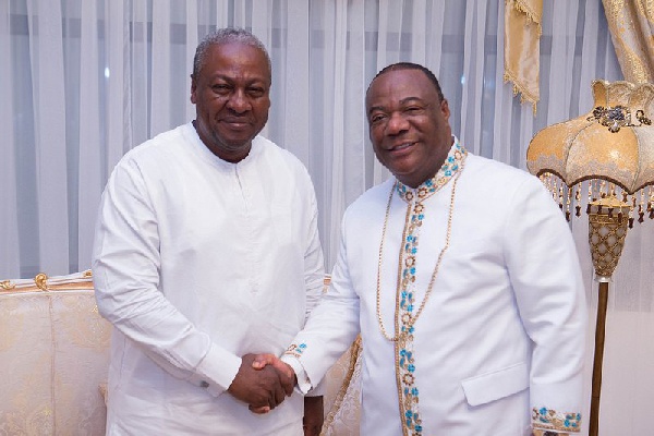 President John Mahama (left) in a handshake with Archbishop Duncan Williams (right)