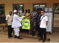 Representatives from Apsonic Motor Limited presenting the items to the Police