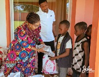 Lordina Mahama distributing goodies to children in Bole