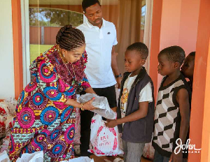 Lordina Mahama distributing goodies to children in Bole