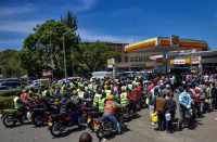 Vehicles queue to buy fuel at a gas station in the Karen suburb of Nairobi