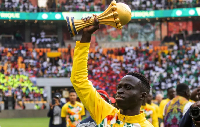 Senegal's Krepin Diatta celebrate as he holds the AFCON trophy before the friendly match