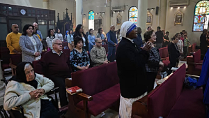 Christian worshippers attend an Easter mass at the Church of the Holy Family in Gaza City