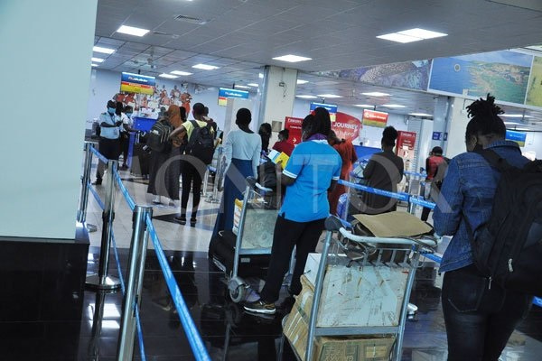 Passengers queue for checking at Entebbe International Airport