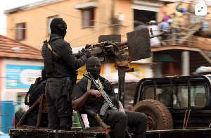 Soldiers patrol on the main road in Bissau, Guinea-Bissau