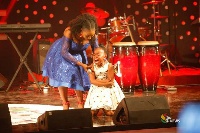 Nellisa Atiogbe being consoled by host Mariam Osei