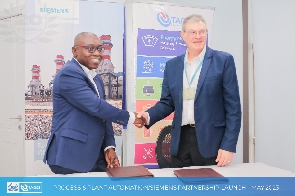 CEO of PPA, Kweku Asmah in a handshake with the Head of Siemens Partner Management André Brits