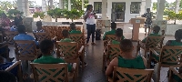 A resource person person educating some students in Lower Manya Krobo about breast cancer