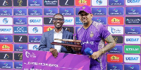 Jackson Kavuma hands over Player of the Match award to ADKR's Windies star Sunil Narine