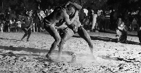 Two men competing in Laamb wrestling/Photo credit: Flickr