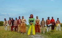 Susan Augustt (green and yellow outfit) with the Adorkor band