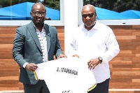 GFA President presenting a jersey to President Mahama ((R)