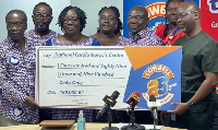 Officials of Promasidor presenting a cheque of GH¢489,900 to the National Cardiothoracic Centre