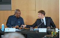 President John Dramani Mahama (L) is seen with French President Emmanuel Macron