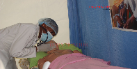 A student demonstrates clinical skills during a raining and Health Care Conference 2026 in Jinja.