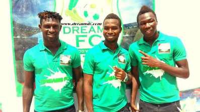 Some players of Dreams FC displaying shirts of Rich Dons Catering services