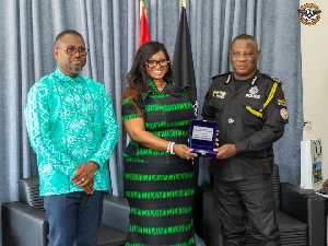 Maame Efua Houadjeto (M) with her Deputy Abeiku Santana and the IGP during the meeting