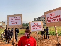 One of the demonstrators holding some placards