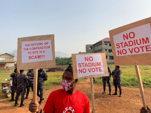 One of the demonstrators holding some placards