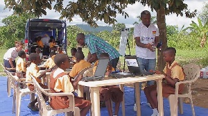 Some school children learning at the  E-Library