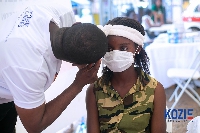 A child getting her eyes screened