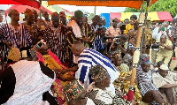 Naa Fuseini Seidu Pelpuo IV shaking hands with the Minister of Chieftaincy and Religious Affairs