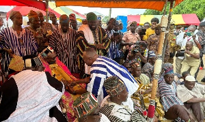 Naa Fuseini Seidu Pelpuo IV shaking hands with the Minister of Chieftaincy and Religious Affairs