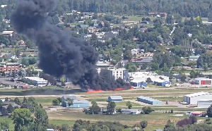 Black smoke billowing across the city after the crash